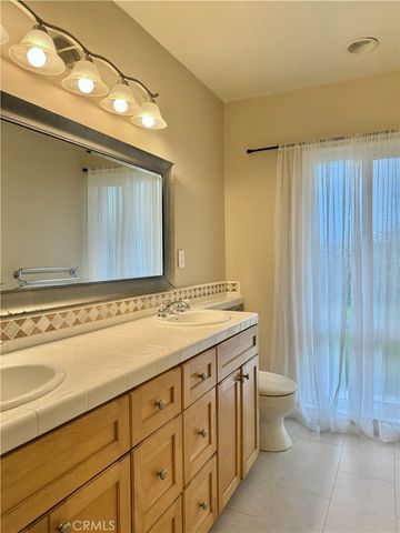 a view of a backyard with plants and lake view