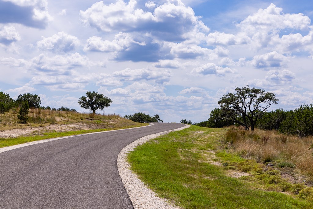 422 Dark Sky Path, Unit 9 Kerrville, TX 78028 - Photo 11 of 37 a view of a lake with a house