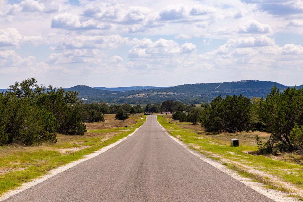 422 Dark Sky Path, Unit 9 Kerrville, TX 78028 - Photo 13 of 37 a view of a swimming pool with a garden
