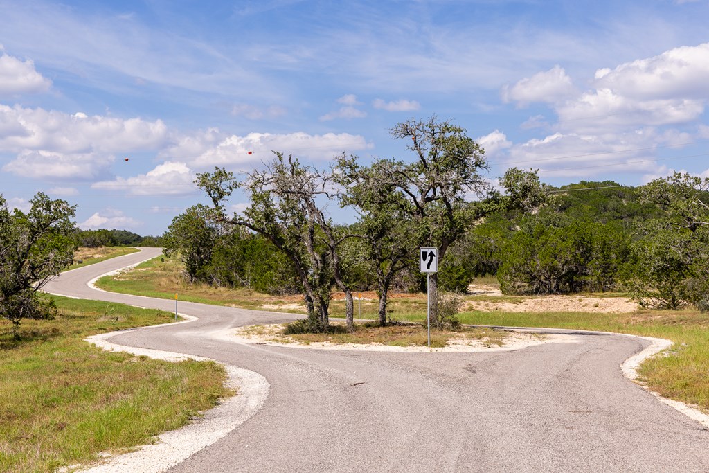 422 Dark Sky Path, Unit 9 Kerrville, TX 78028 - Photo 14 of 37 a view of a playground with basketball court