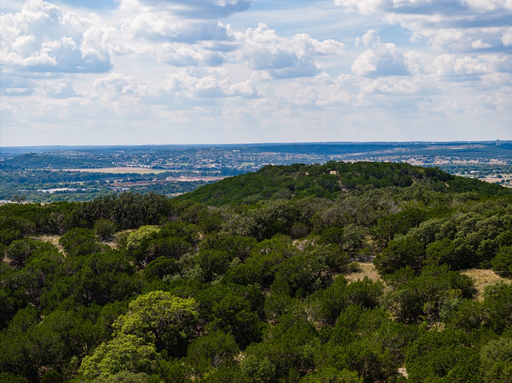 422 Dark Sky Path, Unit 9 Kerrville, TX 78028 - Photo 29 of 37 an aerial view of residential building and trees