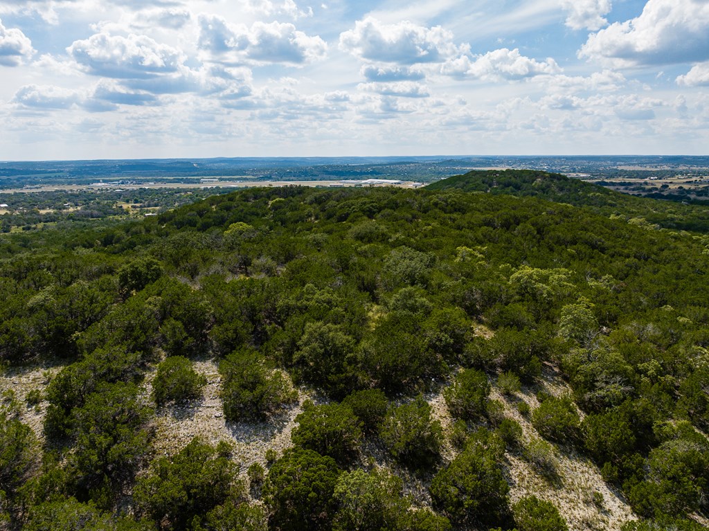 422 Dark Sky Path, Unit 9 Kerrville, TX 78028 - Photo 31 of 37 an aerial view of houses covered in trees
