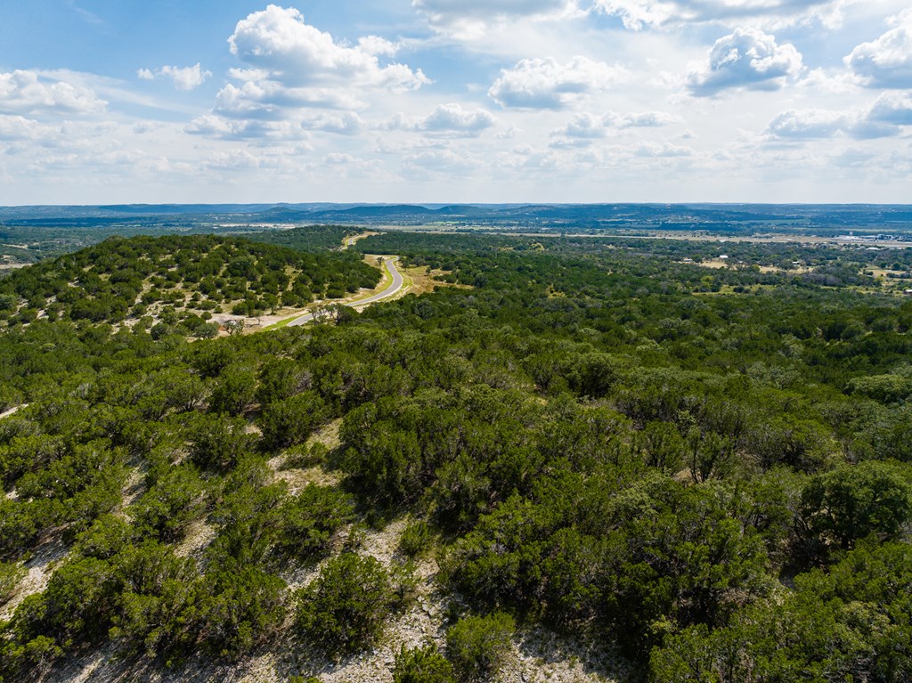 422 Dark Sky Path, Unit 9 Kerrville, TX 78028 - Photo 32 of 37 a view of a yard with an outdoor space