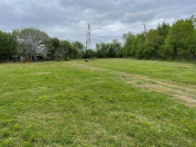 6602 Clara Lane Rosharon, TX 77583 - Photo 1 of 5 a view of a grassy field with trees in the background