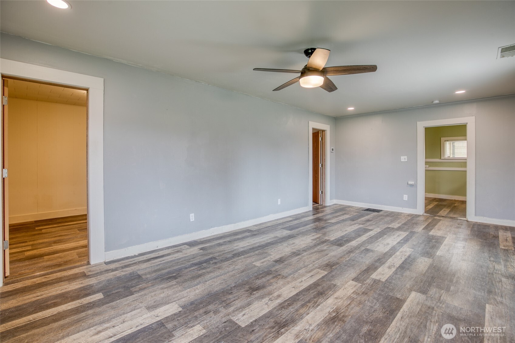 1319 West 2nd Street Aberdeen, WA 98520 - Photo 17 of 25 a view of an empty room with wooden floor and a window