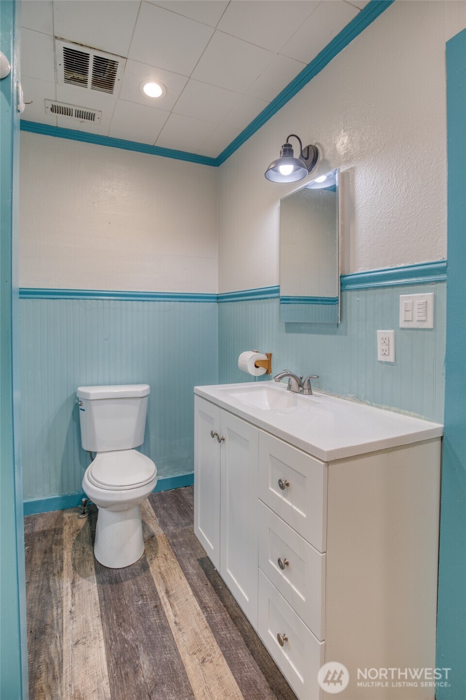 1319 West 2nd Street Aberdeen, WA 98520 - Photo 19 of 25 a bathroom with a sink vanity and a toilet