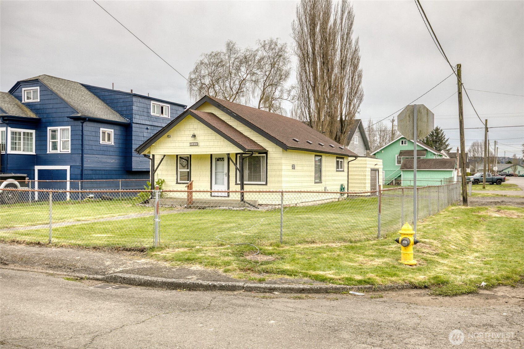 1319 West 2nd Street Aberdeen, WA 98520 - Photo 3 of 25 a view of a house with a swimming pool