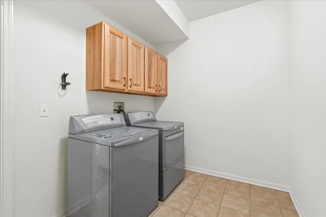 a utility room with a sink washer and dryer