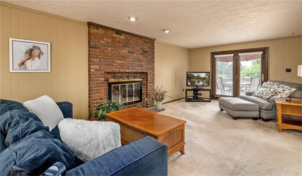 104 Yorktown Road Canonsburg, PA 15317 - Photo 13 of 25 Gather family and friends to cheer your favorite team...or snuggle in front of the fireplace on movie night! The family room has access to the deck for easy outdoor dining and entertaining...