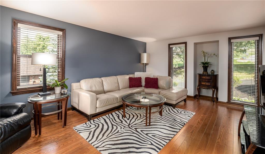 104 Yorktown Road Canonsburg, PA 15317 - Photo 6 of 25 Ready to suit YOUR needs! The living room has gleaming hardwood flooring and floor-to-ceiling windows to allow plenty of natural light!