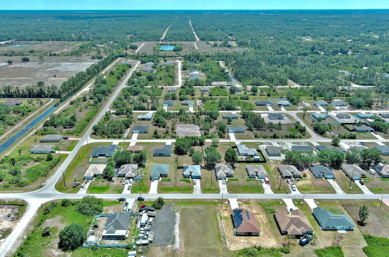 548 Windermere Drive Lehigh Acres, FL 33972 - Photo 25 of 26 an aerial view of multiple house