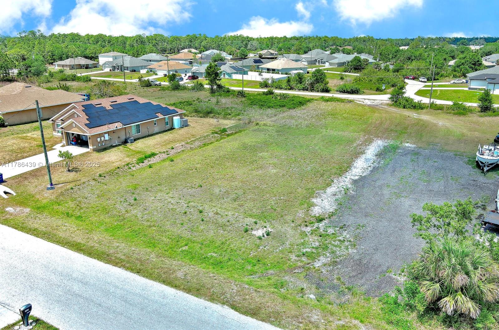 548 Windermere Drive Lehigh Acres, FL 33972 - Photo 6 of 26 a view of a city street view and lake view