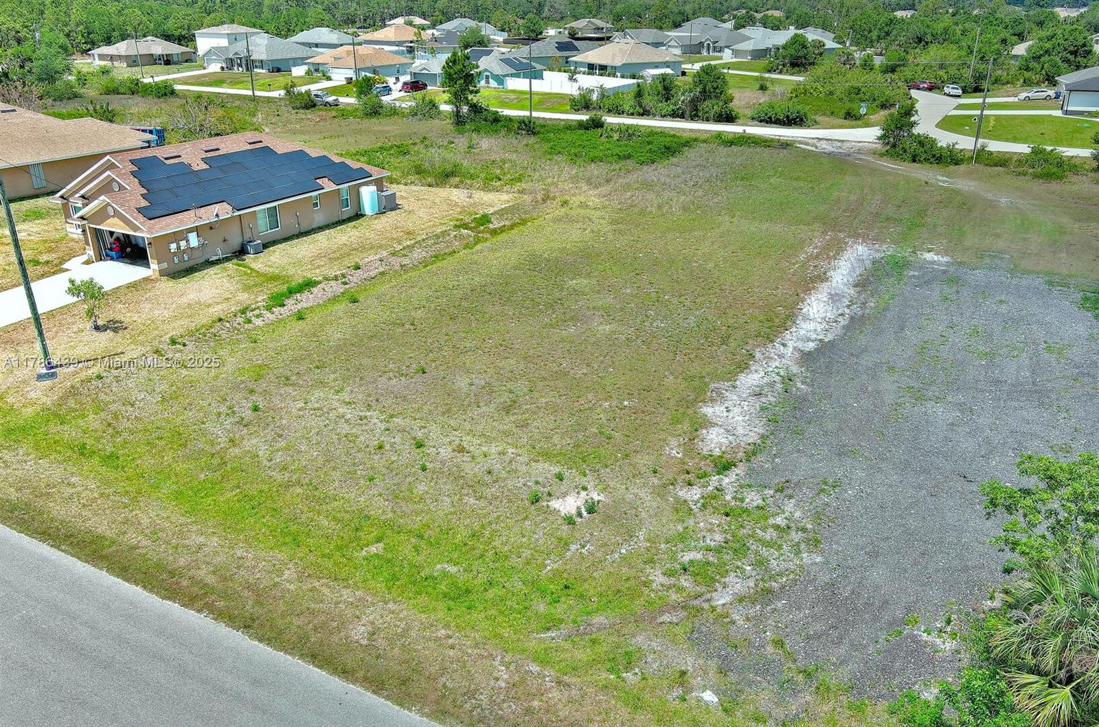 548 Windermere Drive Lehigh Acres, FL 33972 - Photo 7 of 26 a view of yard with outdoor seating