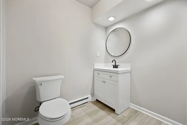 a bathroom with a glass shower door