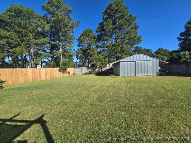 a backyard of a house with lots of green space