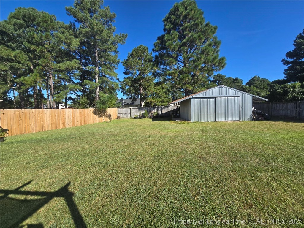 1540 Clan Campbell Drive Raeford, NC 28376 - Photo 17 of 35 a backyard of a house with lots of green space