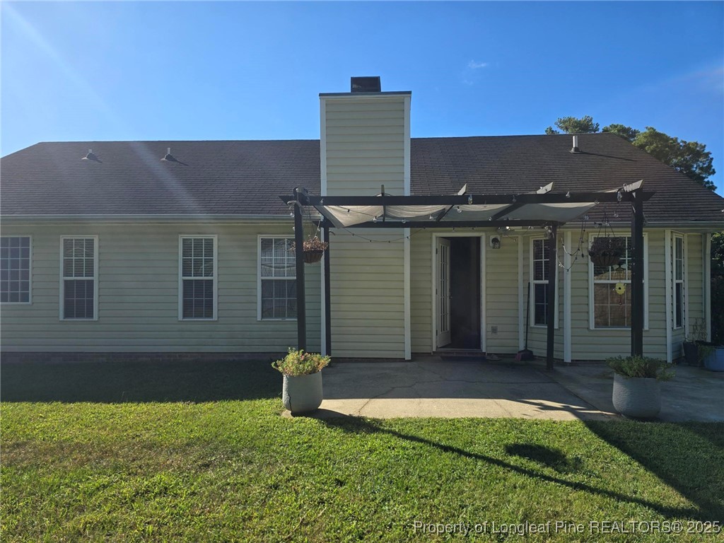1540 Clan Campbell Drive Raeford, NC 28376 - Photo 19 of 35 front view of a house with a yard