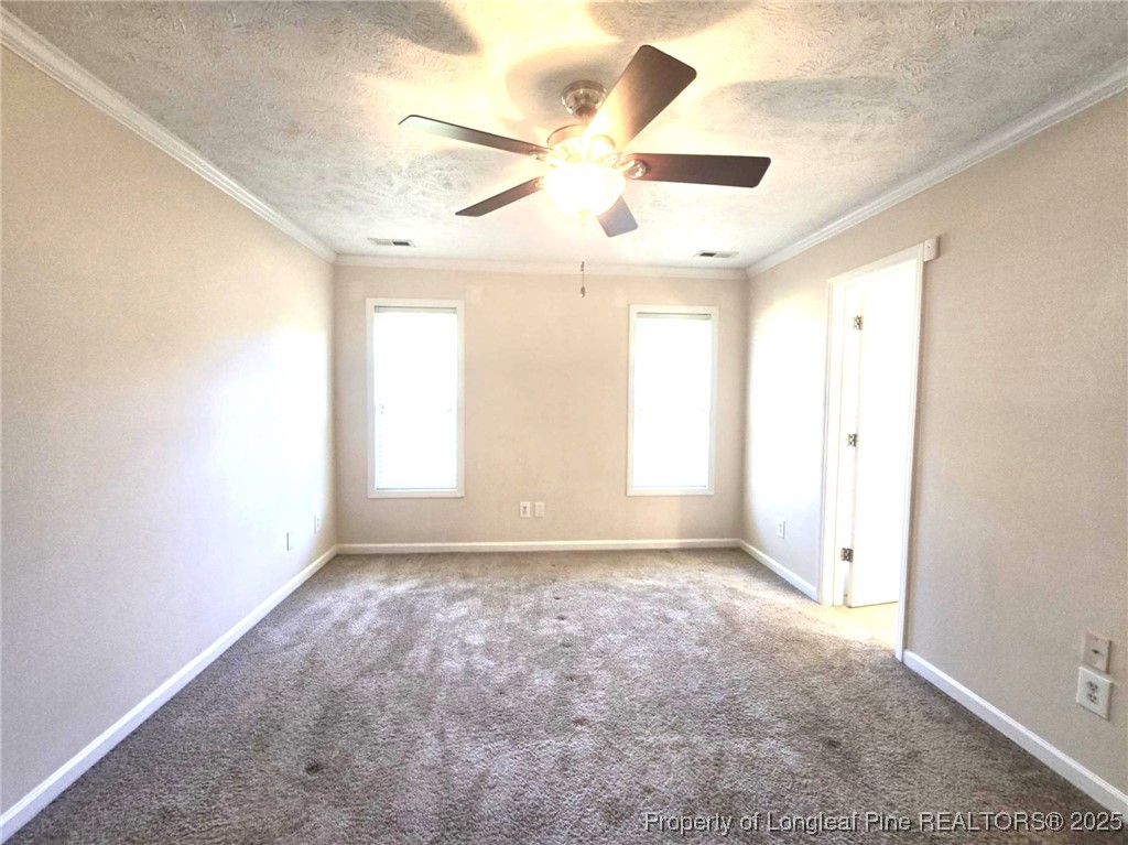 1540 Clan Campbell Drive Raeford, NC 28376 - Photo 20 of 35 an empty room with windows and fan