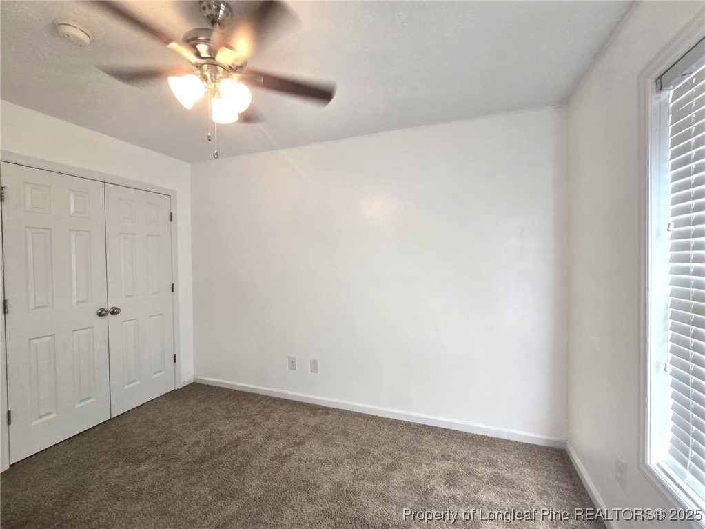 1540 Clan Campbell Drive Raeford, NC 28376 - Photo 30 of 35 an empty room with windows and fan
