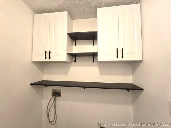 a bathroom with a bathtub and a window