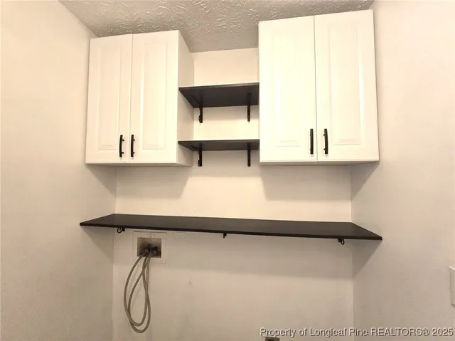 a bathroom with a bathtub and a window