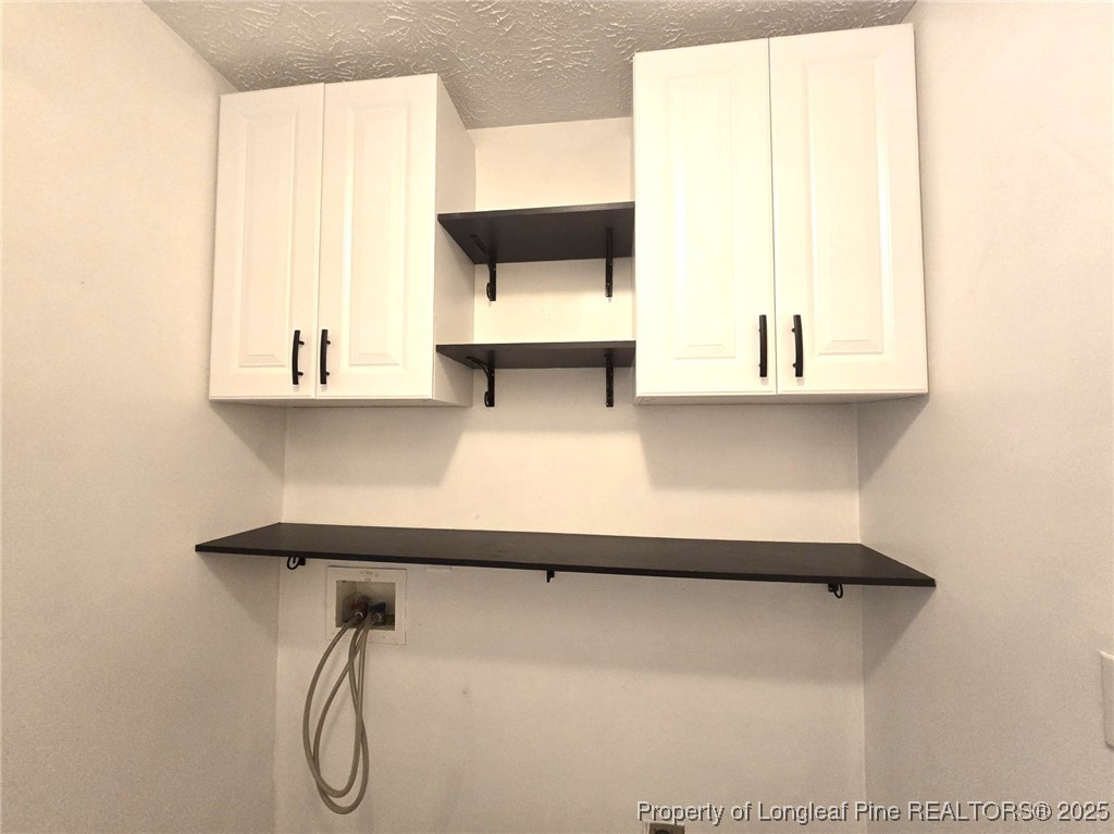 1540 Clan Campbell Drive Raeford, NC 28376 - Photo 35 of 35 a bathroom with a bathtub and a window