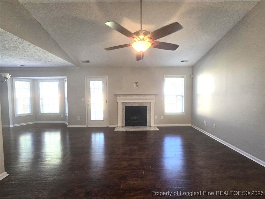 1540 Clan Campbell Drive Raeford, NC 28376 - Photo 5 of 35 a view of an empty room with wooden floor and a window