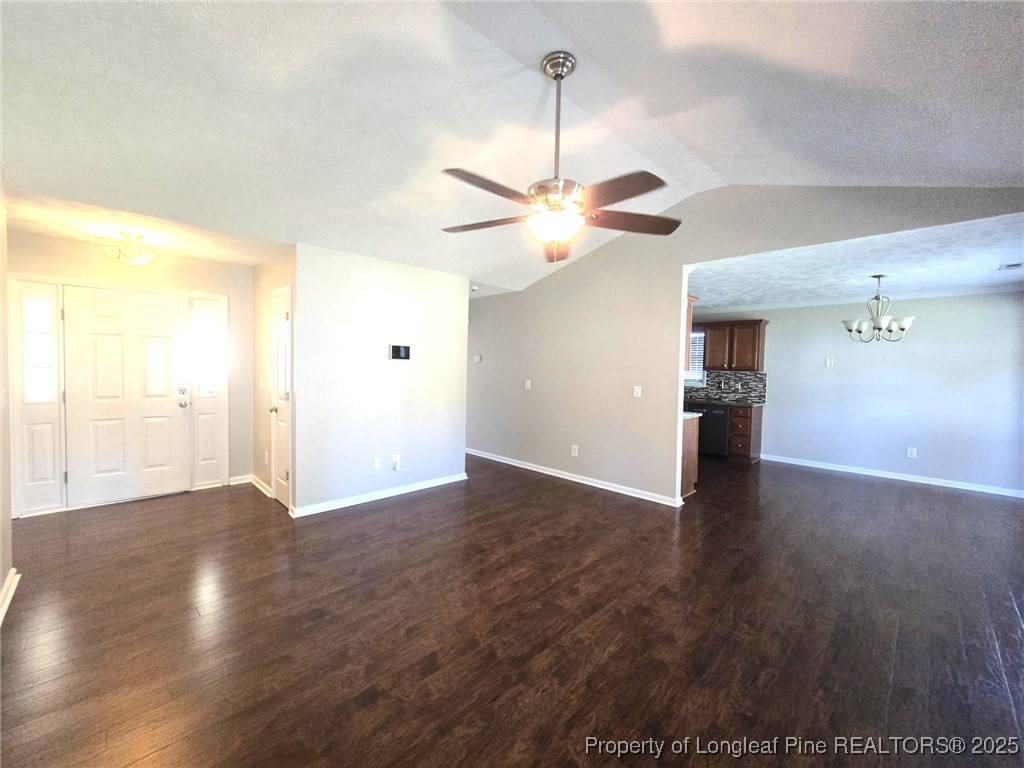 1540 Clan Campbell Drive Raeford, NC 28376 - Photo 8 of 35 a view of an empty room with a window and wooden floor