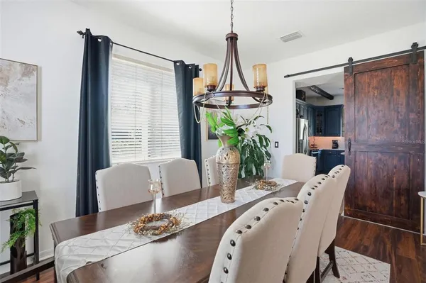 a view of a dining room with furniture window and outside view