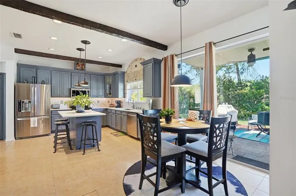 a kitchen with granite countertop a sink dishwasher stove and cabinets