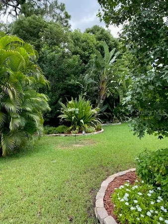 a backyard of a house with lots of green space