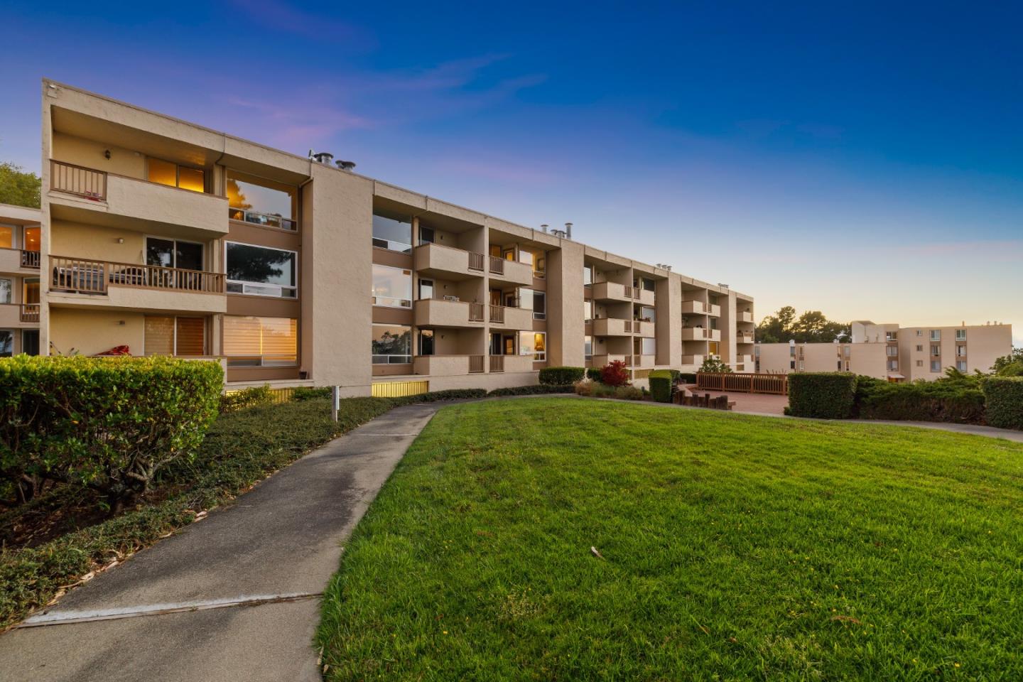 a view of a house with backyard and porch
