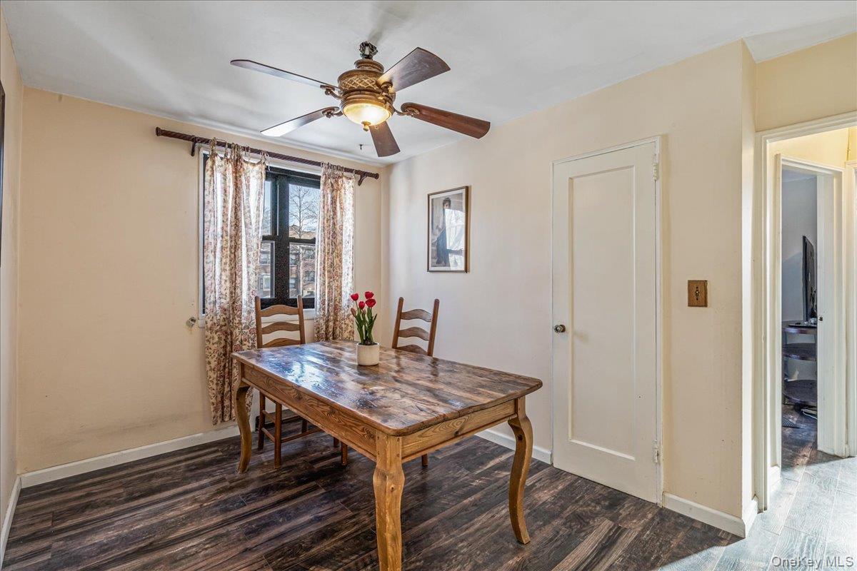 242-68 Horace Harding Expressway, Unit UPPR Queens, NY 11362 - Photo 6 of 11 a view of a dining room with furniture window and wooden floor