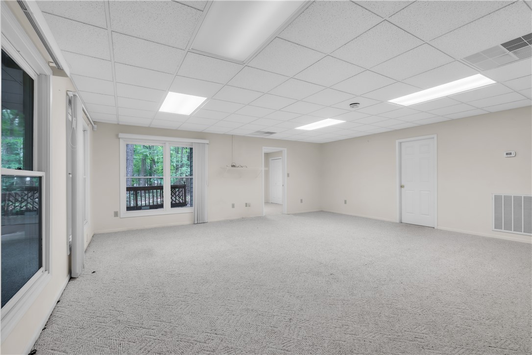 149 Inlet Pointe Drive Anderson, SC 29625 - Photo 10 of 43 A spacious lower level retreat with a forest view, offering ample room for leisure.