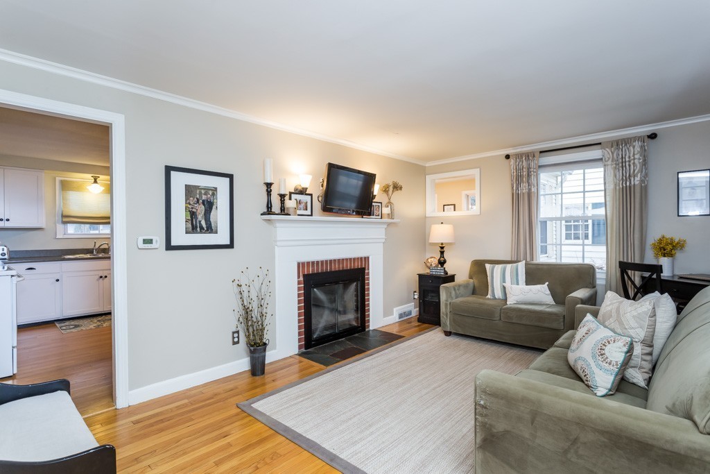 75 Pilgrim Road Springfield, MA 01118 - Photo 8 of 30 a living room with furniture and a fireplace