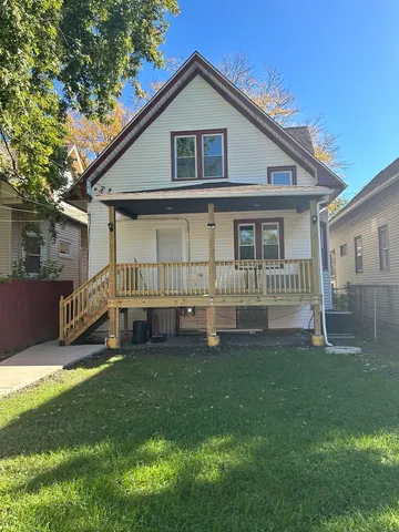 a view of a backyard with sitting area