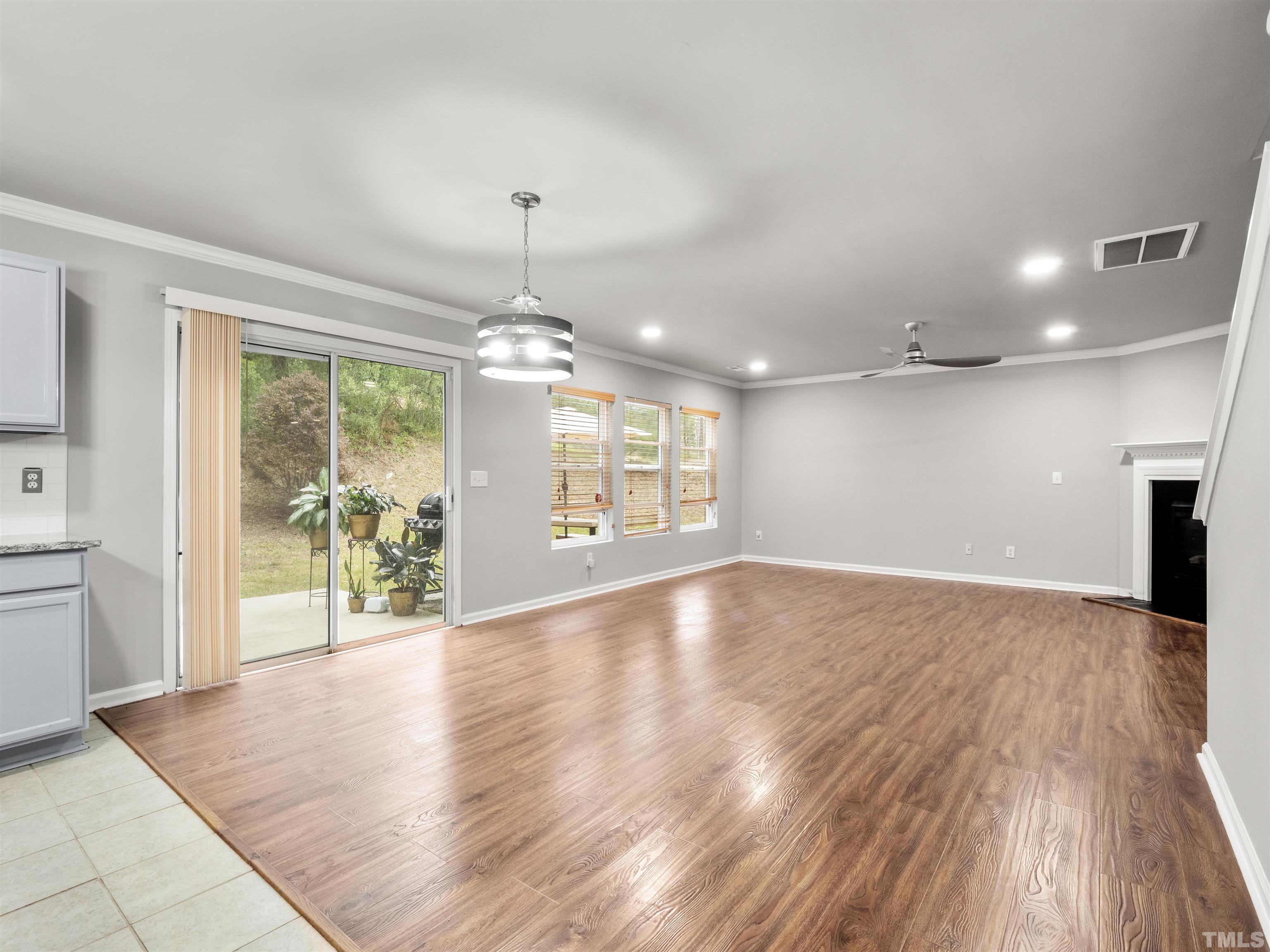 4 Red Spring Court Durham, NC 27703 - Photo 16 of 35 a view of an empty room with window and wooden floor