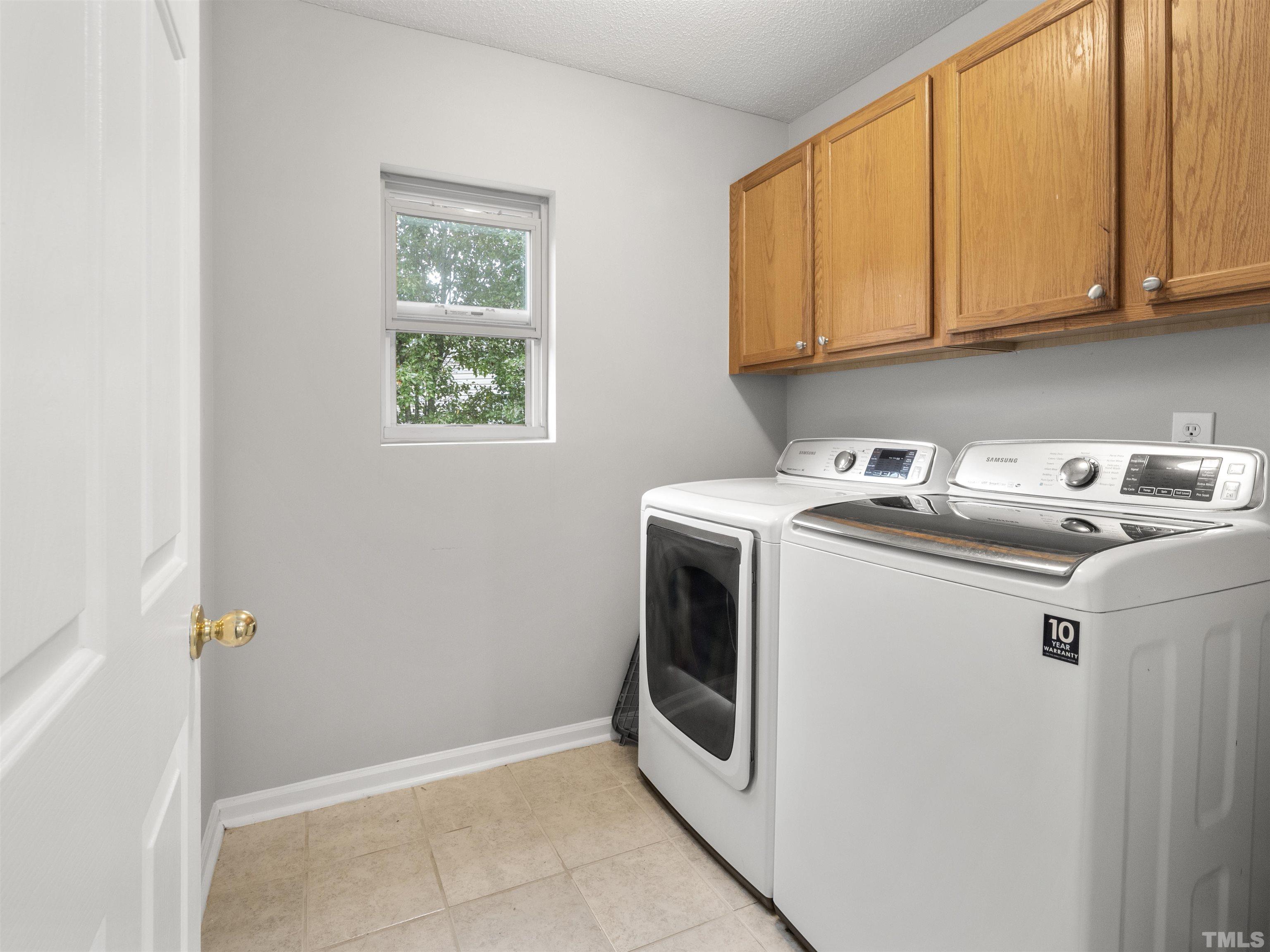 4 Red Spring Court Durham, NC 27703 - Photo 17 of 35 a utility room with dryer and washer