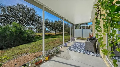 a view of a chair and table in the patio