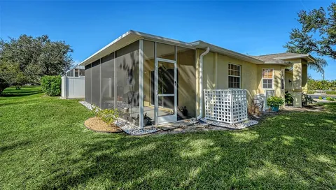 a view of a house with backyard