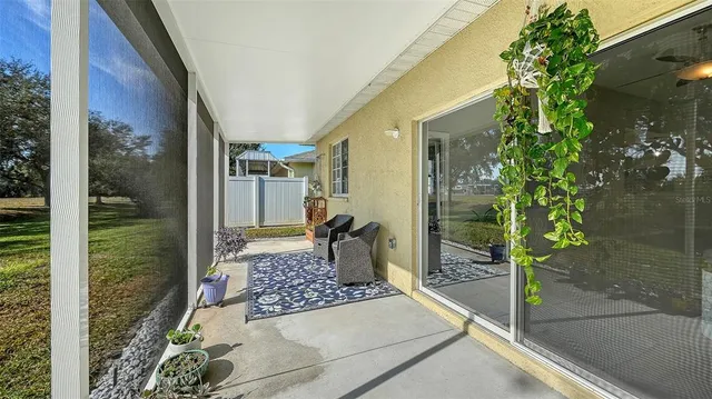 a view of a chair and table in the patio