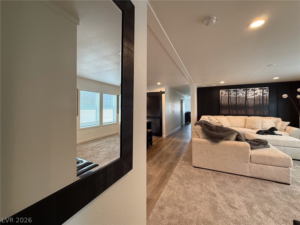464 Box Canyon Road Alamo, NV 89001 - Photo 31 of 48 A spacious layout showcases transitions between recessed-lit ceilings, plush carpeting, and wood-finish flooring.
