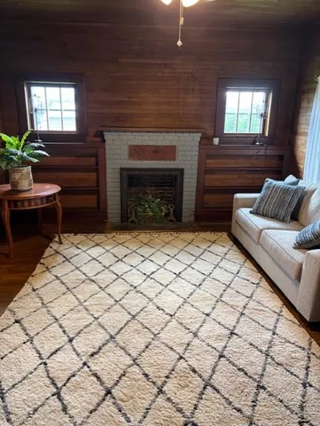 a living room with furniture and a fireplace