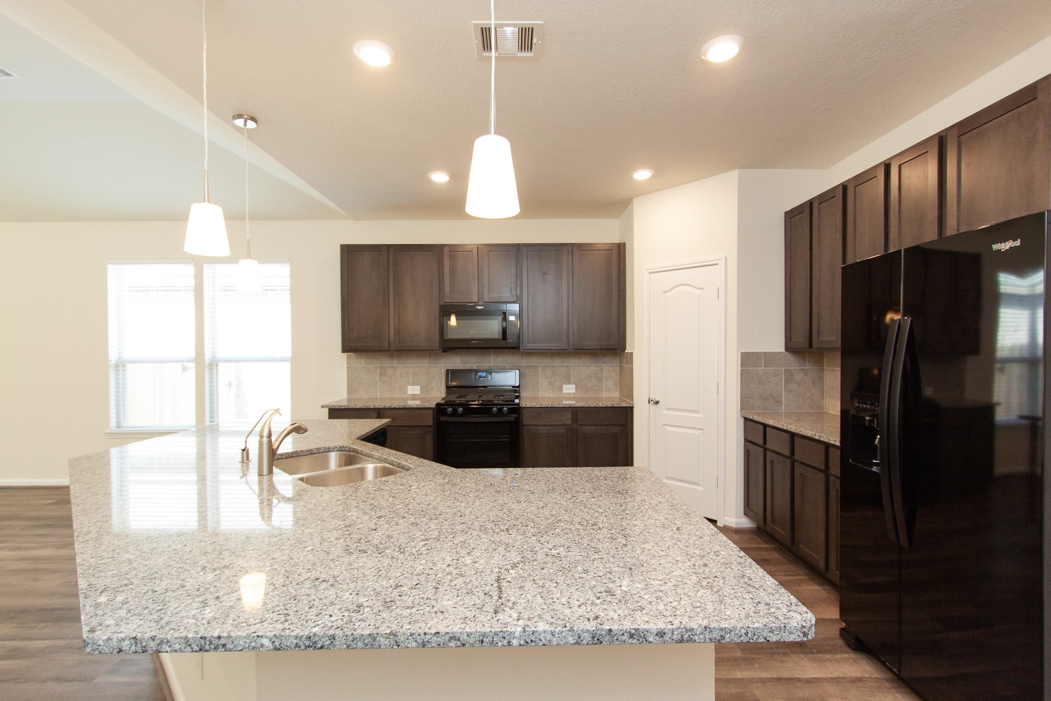 2011 Parnevik Place Conroe, TX 77304 - Photo 19 of 37 This is view of the breakfast bar and your very spacious and open kitchen.