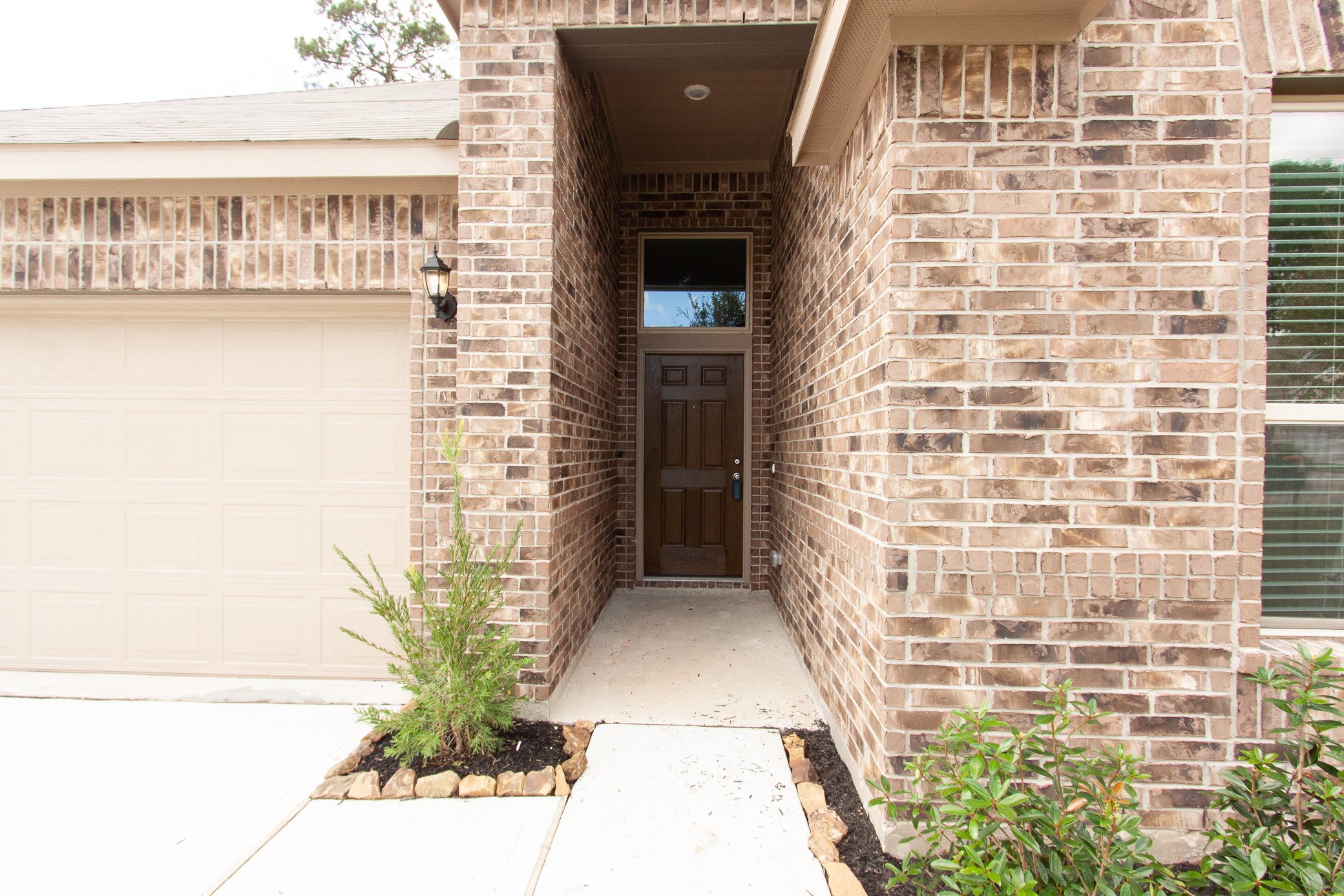 2011 Parnevik Place Conroe, TX 77304 - Photo 2 of 37 The view walking to the door shows a long stretch of walk way with 6 ft door.