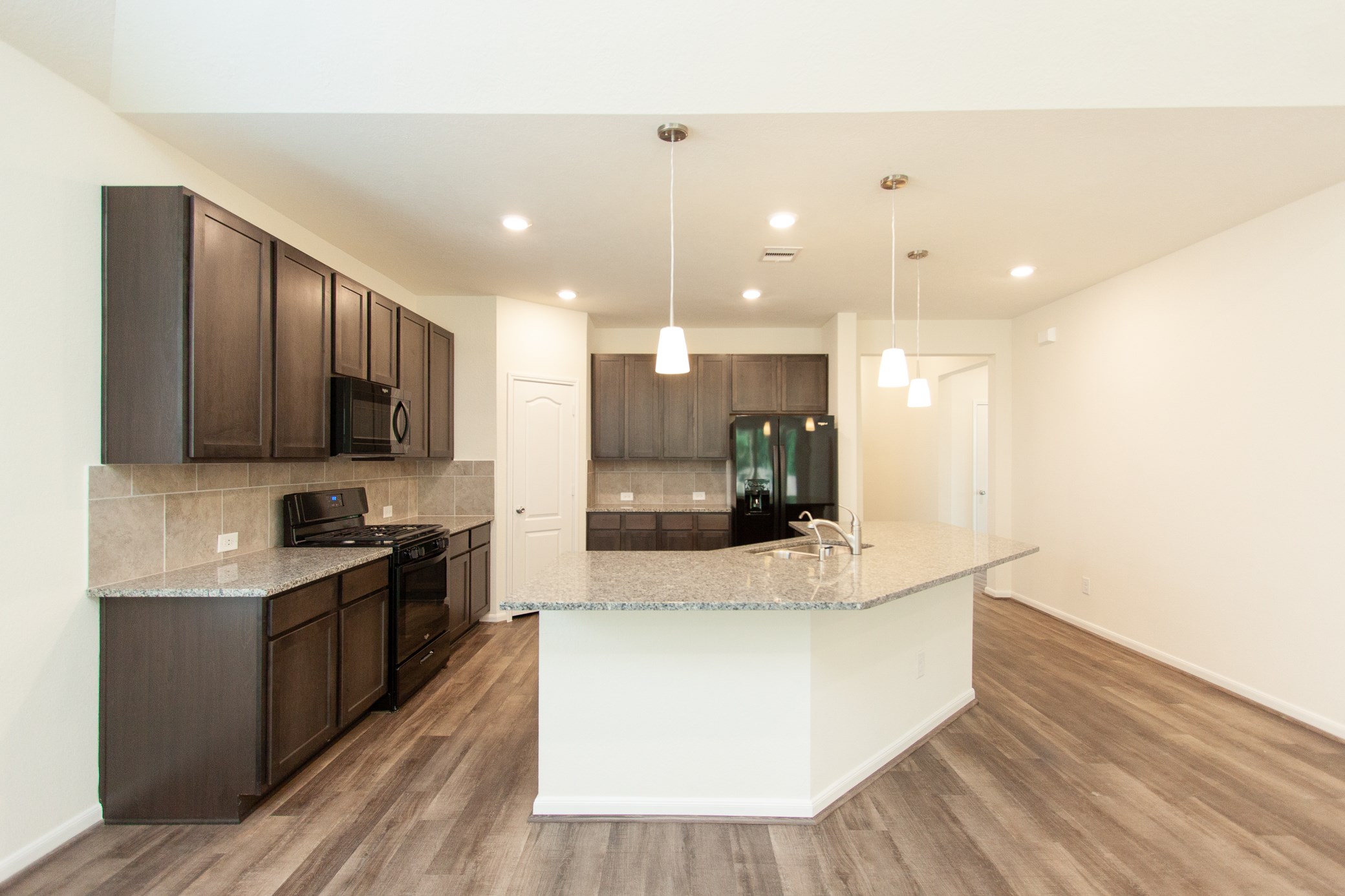 2011 Parnevik Place Conroe, TX 77304 - Photo 21 of 37 Another view of the kitchen.