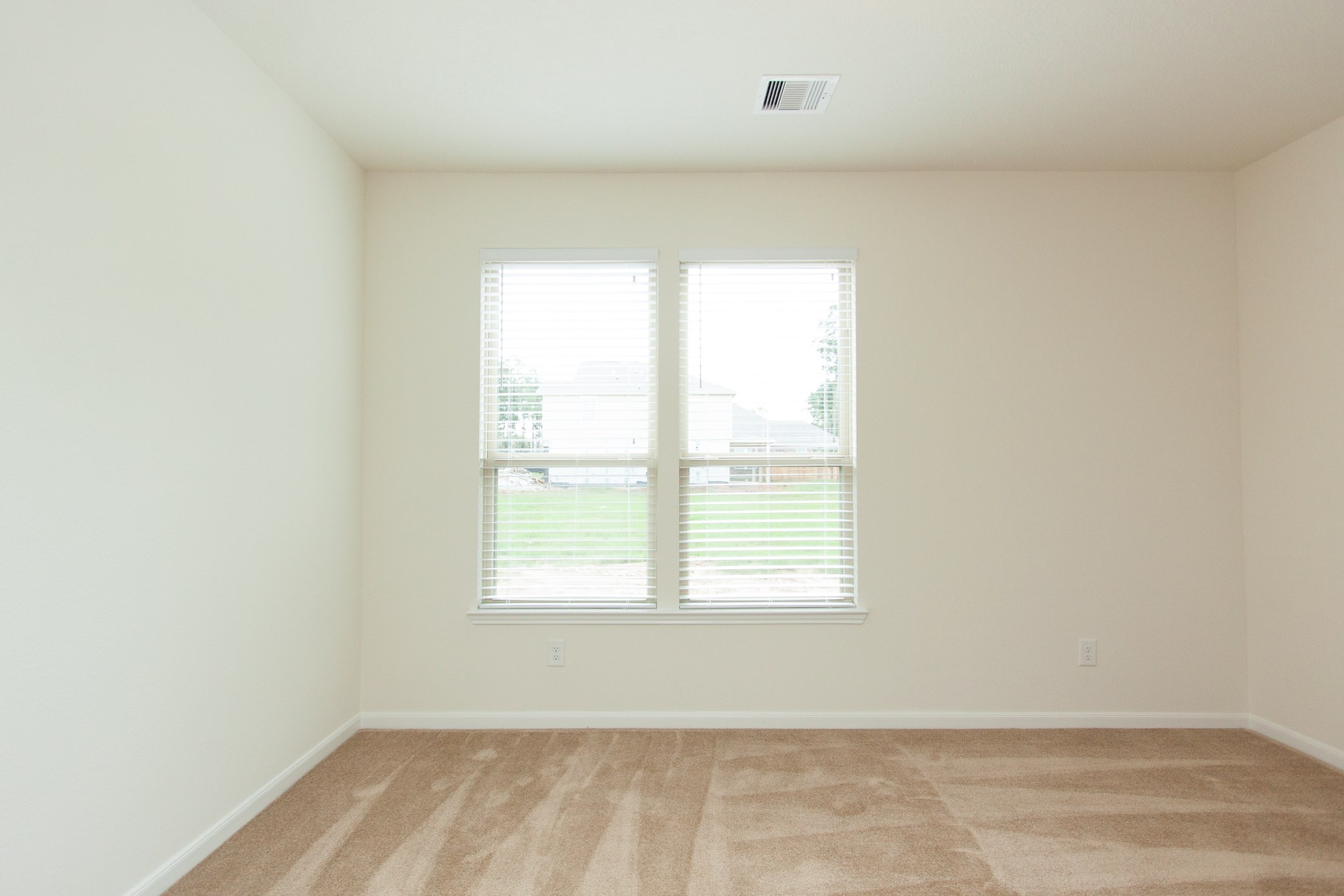 2011 Parnevik Place Conroe, TX 77304 - Photo 25 of 37 A view of the second bedroom overlooking the lot next door.
