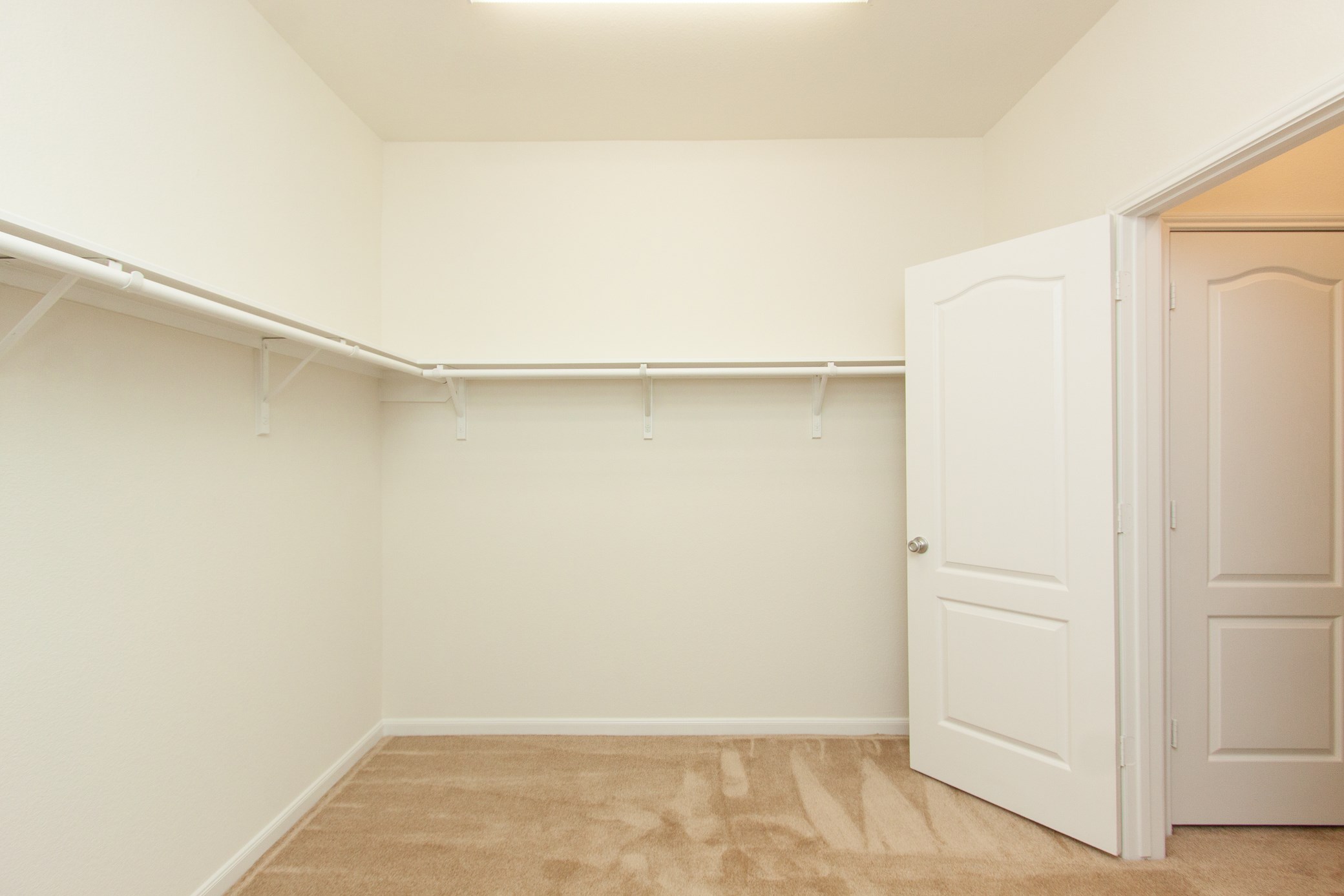 2011 Parnevik Place Conroe, TX 77304 - Photo 27 of 37 Here's a photo of the massive primary closet.