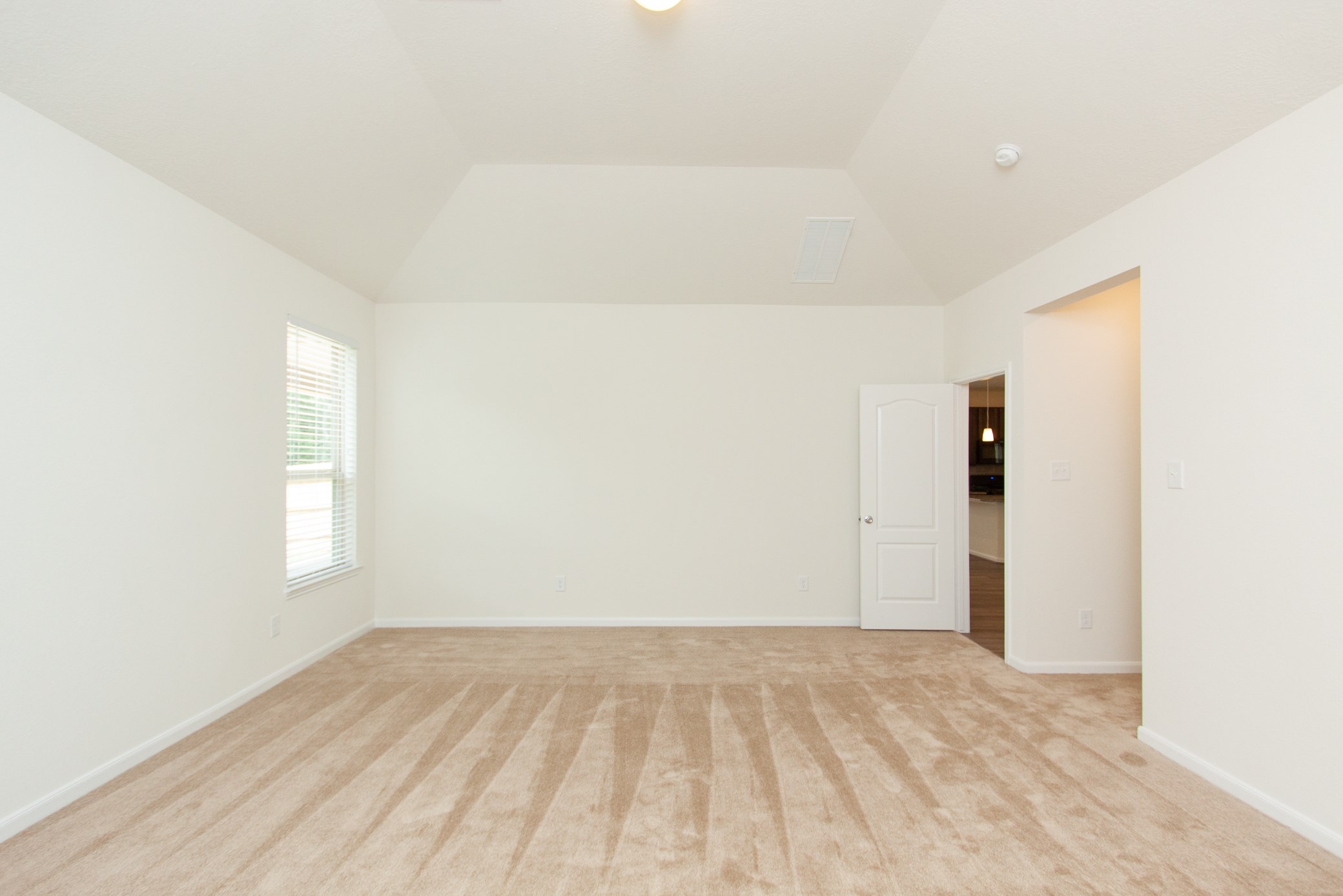 2011 Parnevik Place Conroe, TX 77304 - Photo 5 of 37 The Primary bedroom that is situated overlooking the backyard is 19x16. As you can see, this room has high ceilings and is very spacious.