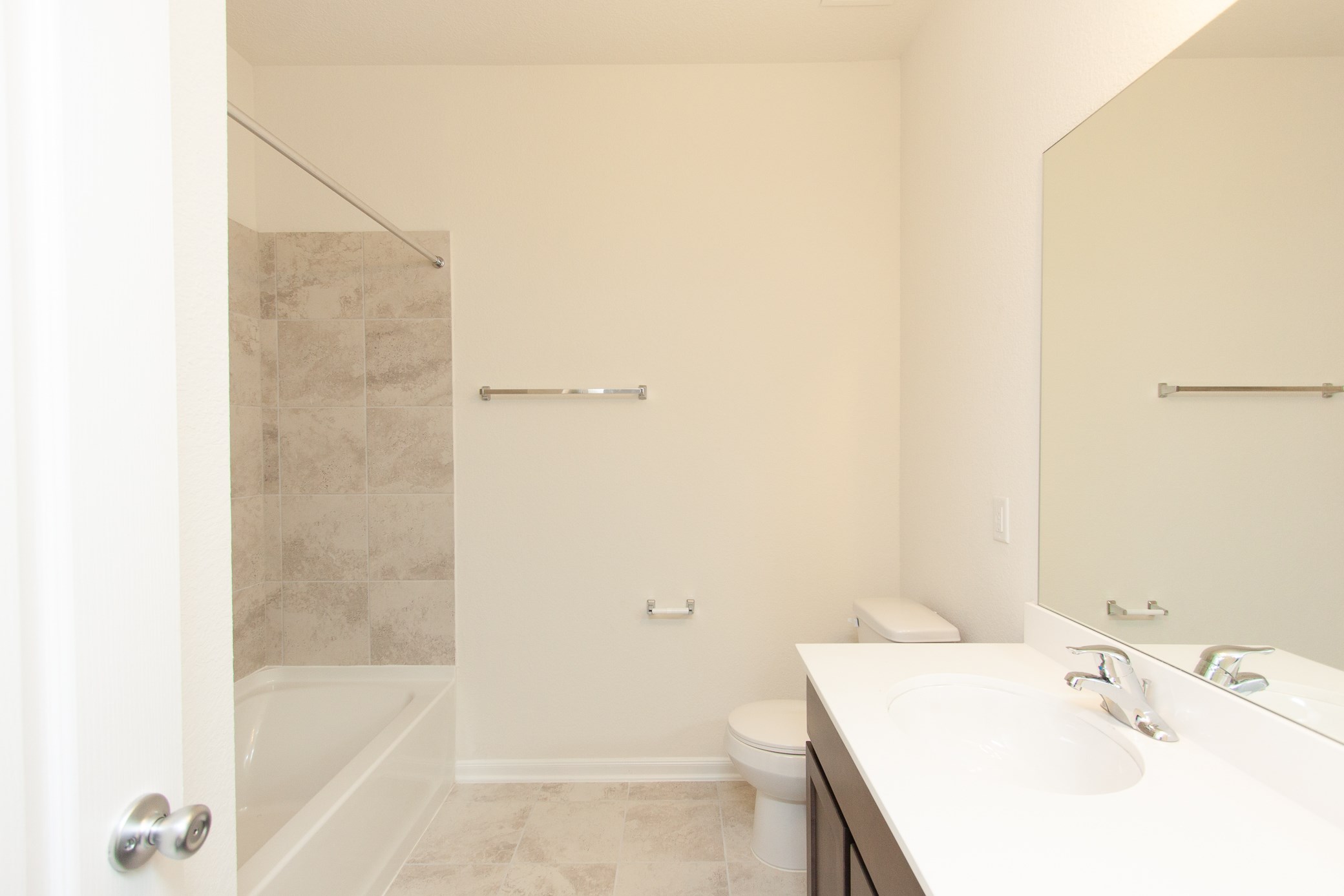 2011 Parnevik Place Conroe, TX 77304 - Photo 7 of 37 As you can see, the guest bathroom has tile, shower tub combo, and tile back splash.